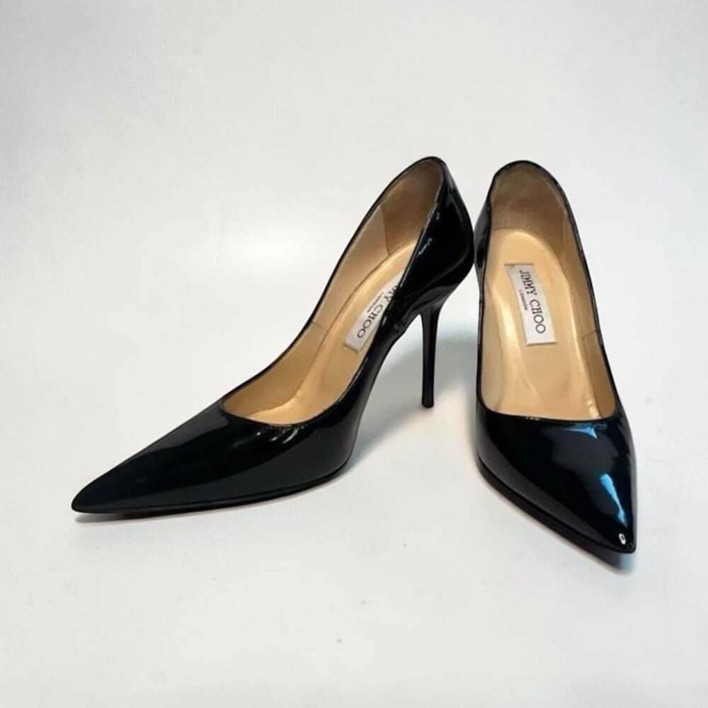 Black Patent Leather Pointed-Toe Pumps with JC Emblem